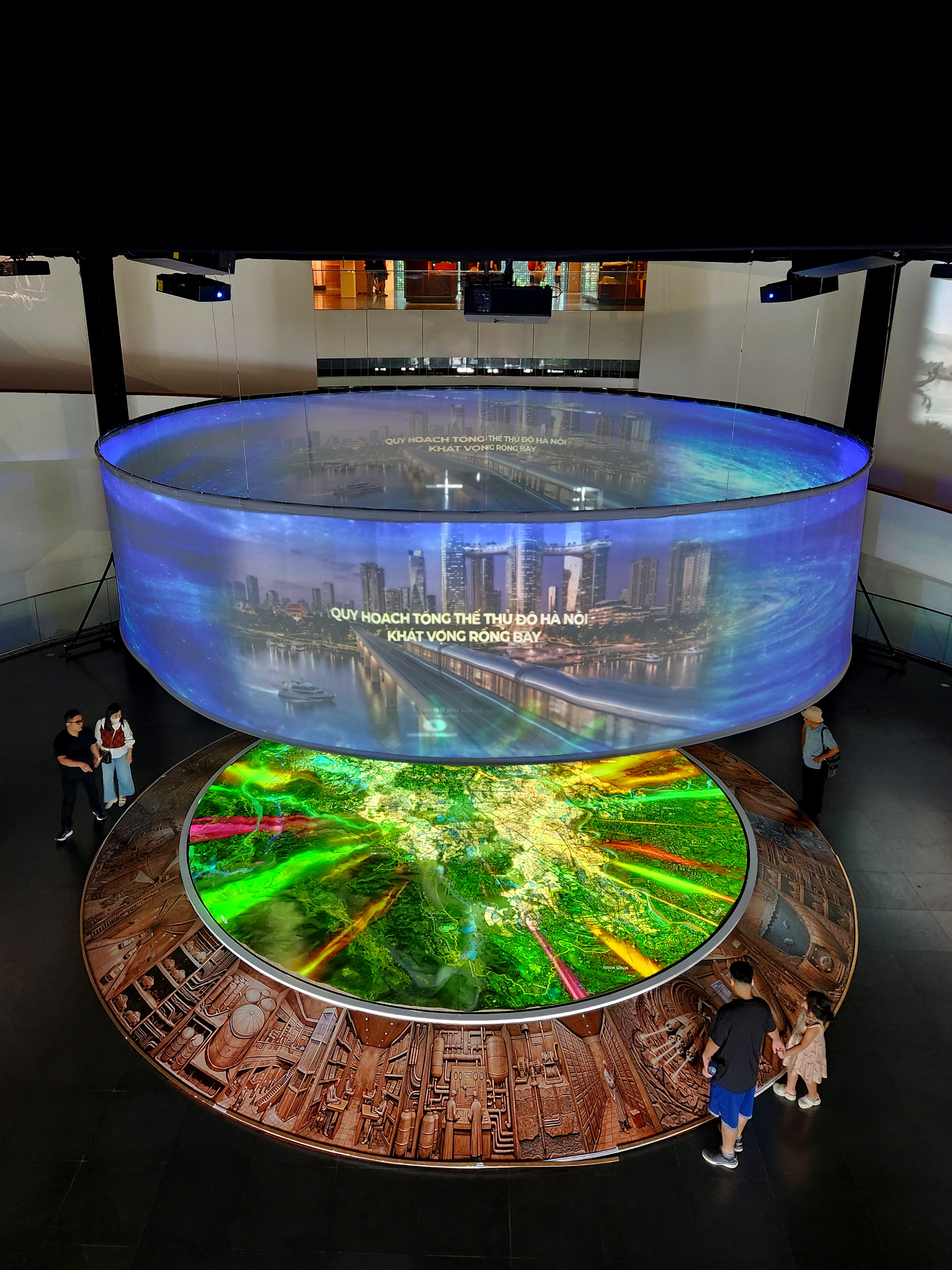 Figure 4. The illuminated city model at the centre of the exhibition, Hanoi 100-Year Development Masterplan Exhibition, Hanoi Museum, Hanoi, Vietnam, 13 July 2026. Photograph by the author.