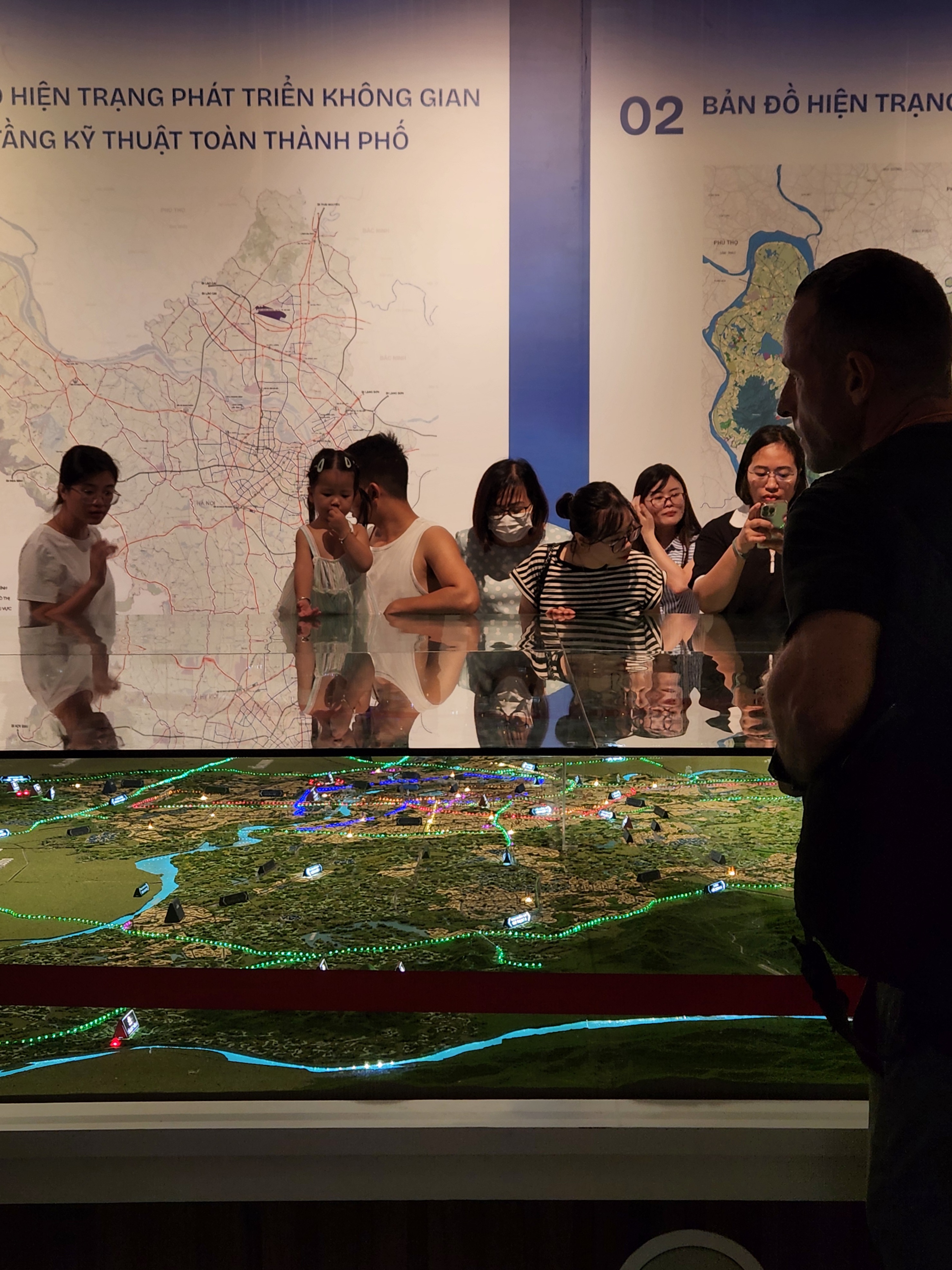 Figure 5. Visitors viewing the current-state development map, Hanoi Museum, Hanoi, Vietnam, 13 July 2026. Photograph by the author.