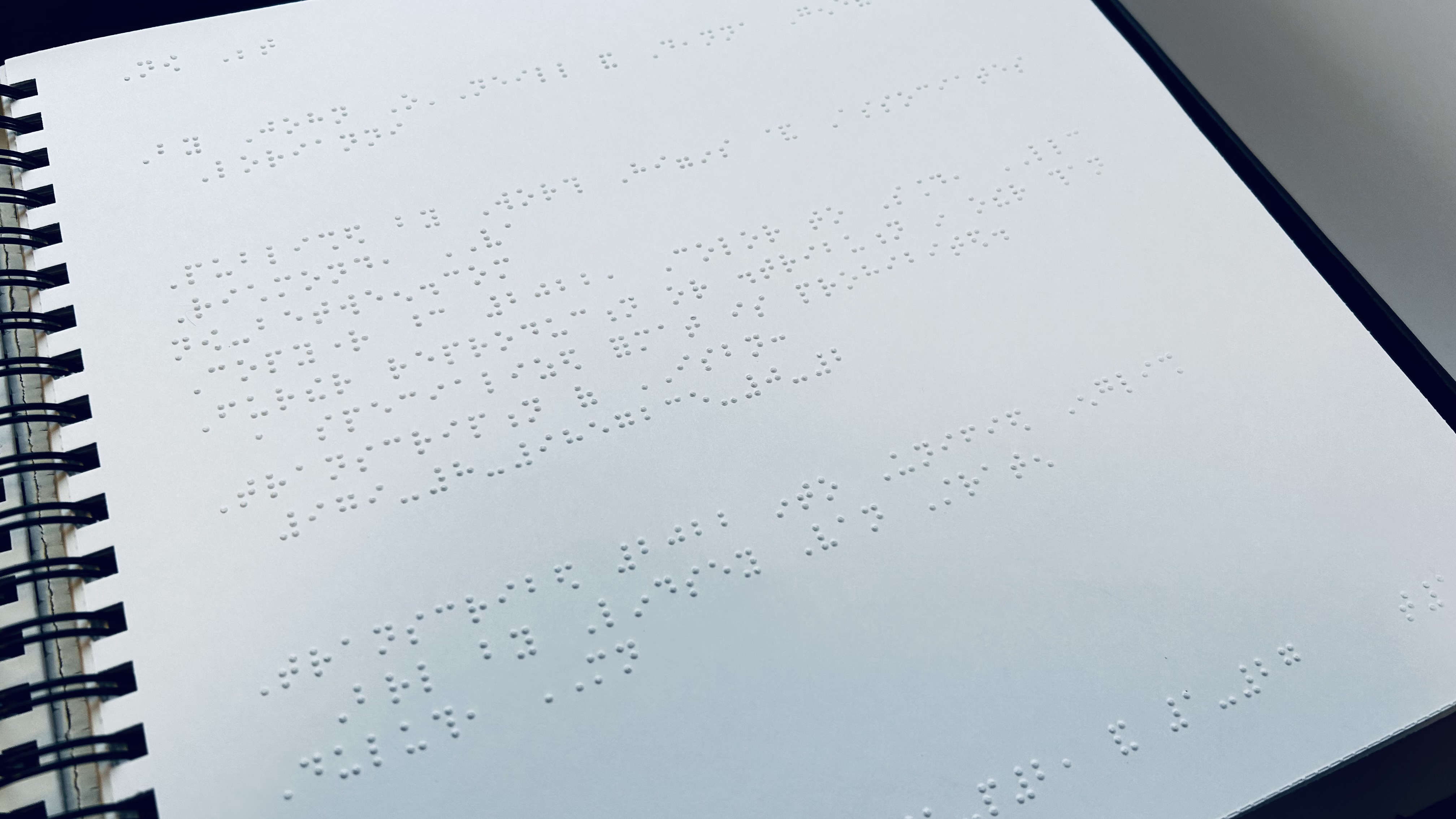 Figure 7. The Braille was printed on Braille paper instead of another material because it was the best option for ensuring that the dots met the standard height of 0.48 millimeters, providing the best reading experience for Braille readers. © John O’Neill and Deanna Geneva Lorianni of Color to Sound, LLC