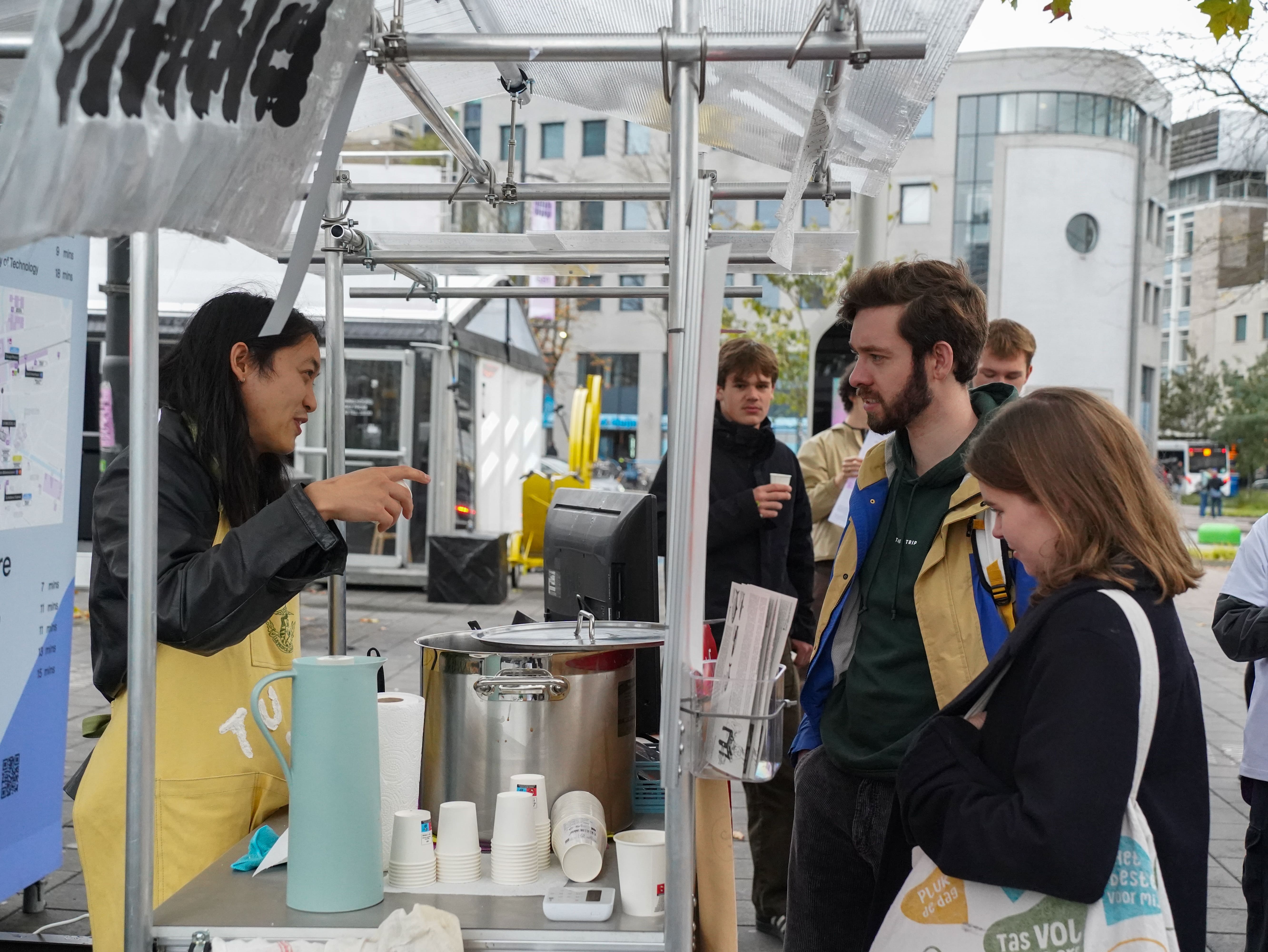 Figure 4. Artist Brandon Chow serving Hong Kong style milk tea at Food Untold food stand, Dutch Design Week 2024. Photograph by the author.